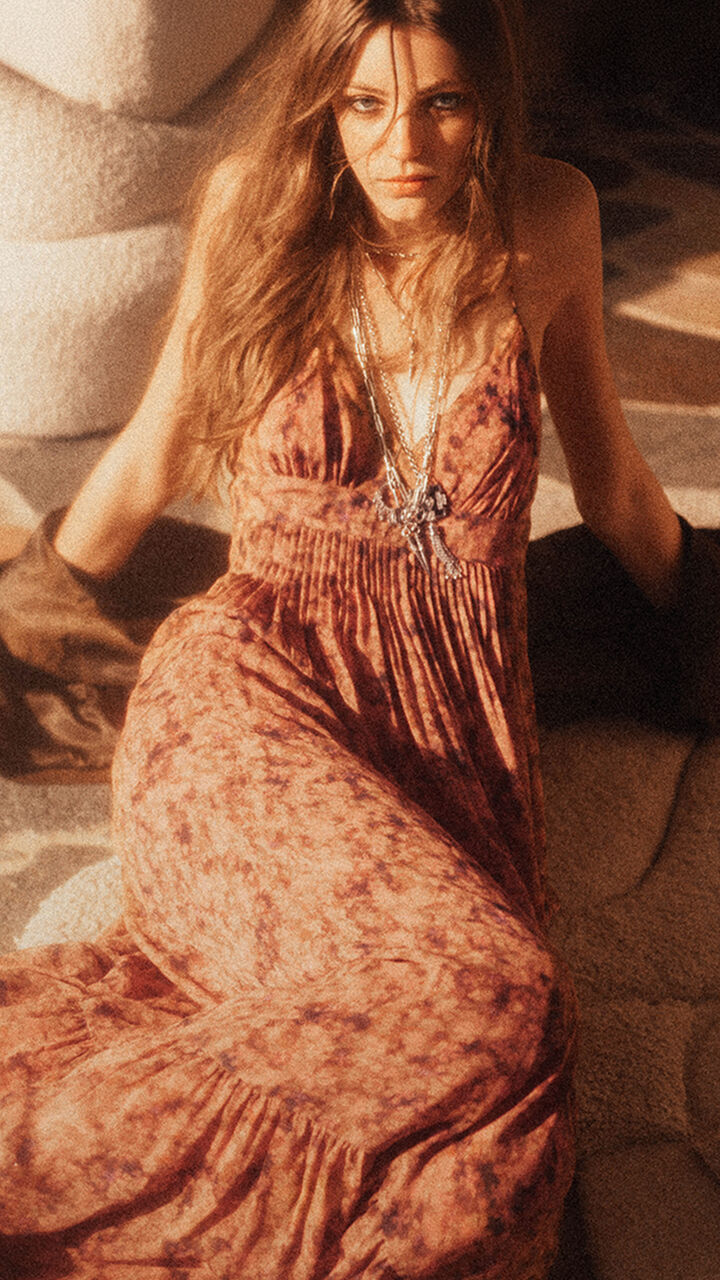 A model wearing a floral printed and lace dress